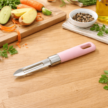 économe rose posé sur un plan de travail