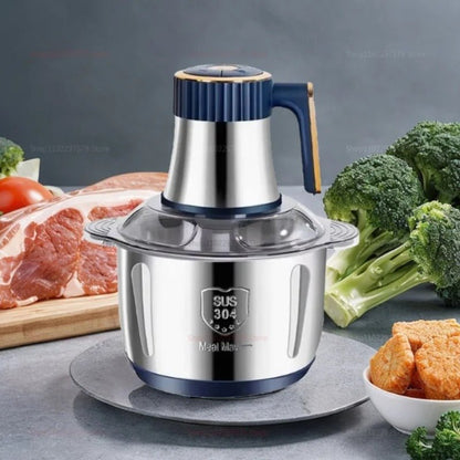 hachoir électrique présenté sur table avec des aliments tout autour