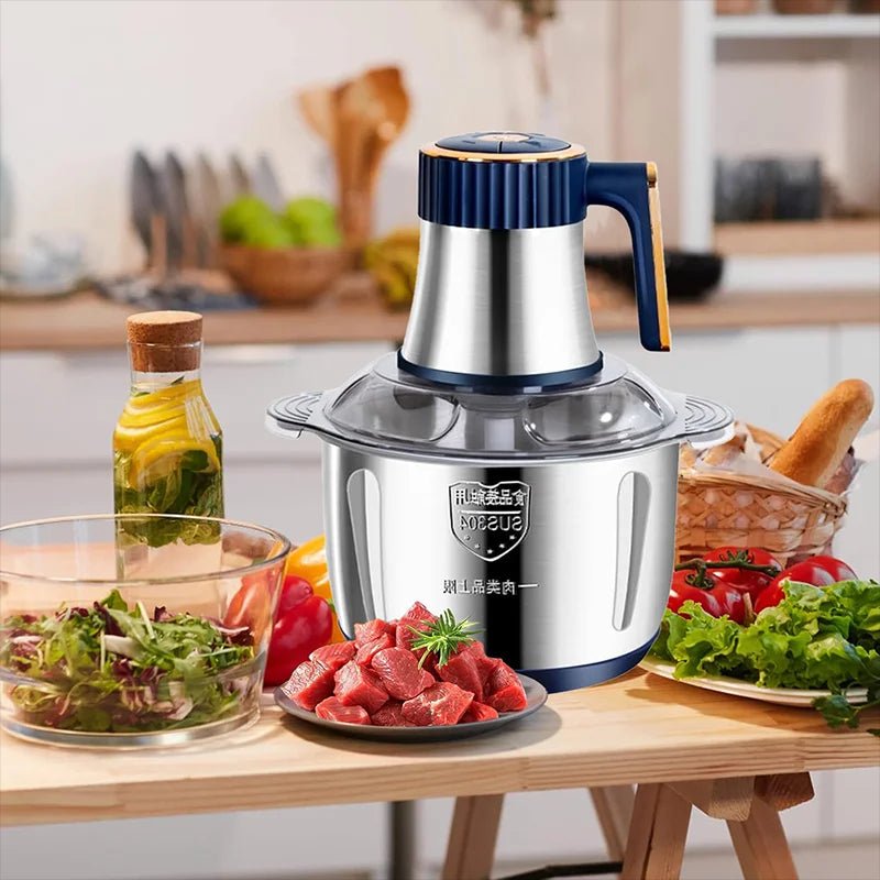 hachoir électrique sur une table avec des légumes