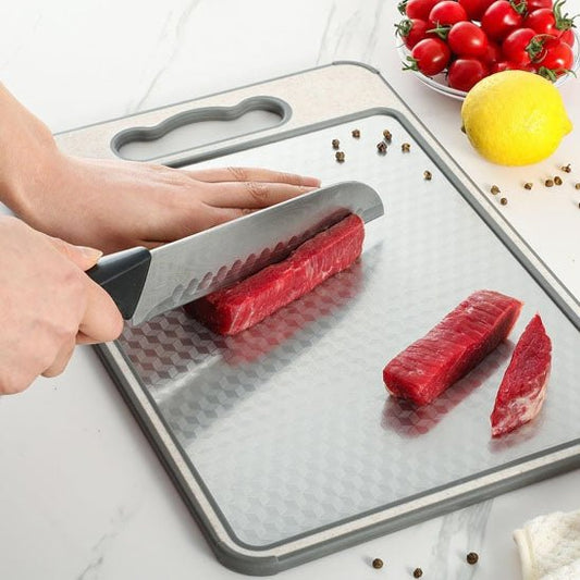 planche a decouper coupe de viande dessus